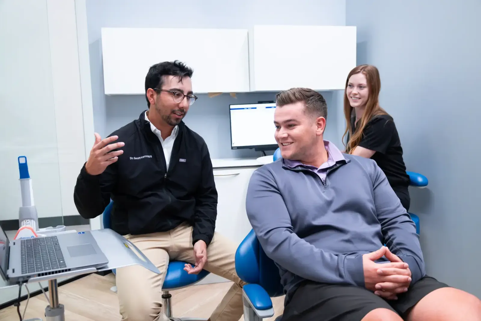 Dentist explaining treatment to patient