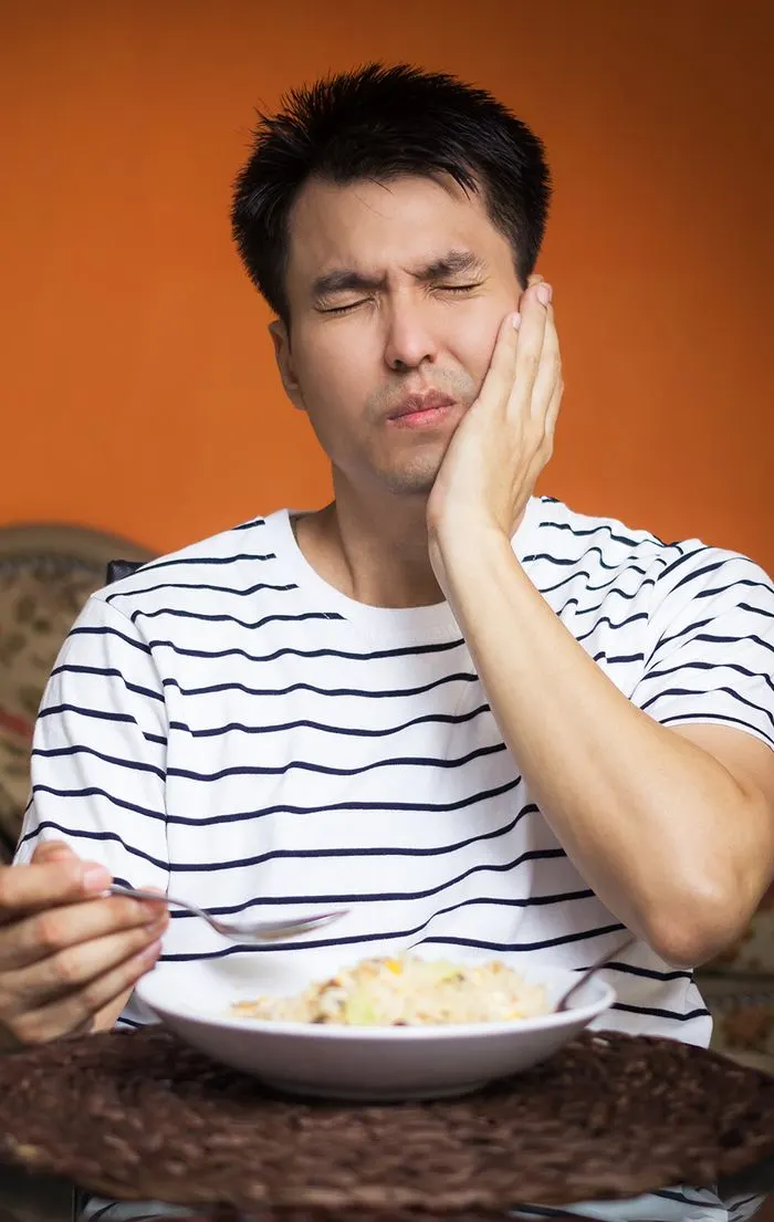 Man experiencing tooth pain