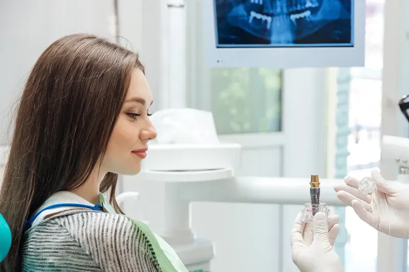 Patient getting oral surgery implant