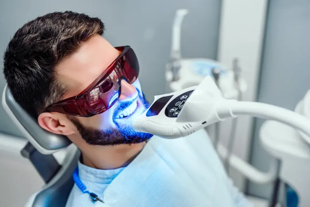 Patient receiving teeth whitening treatment