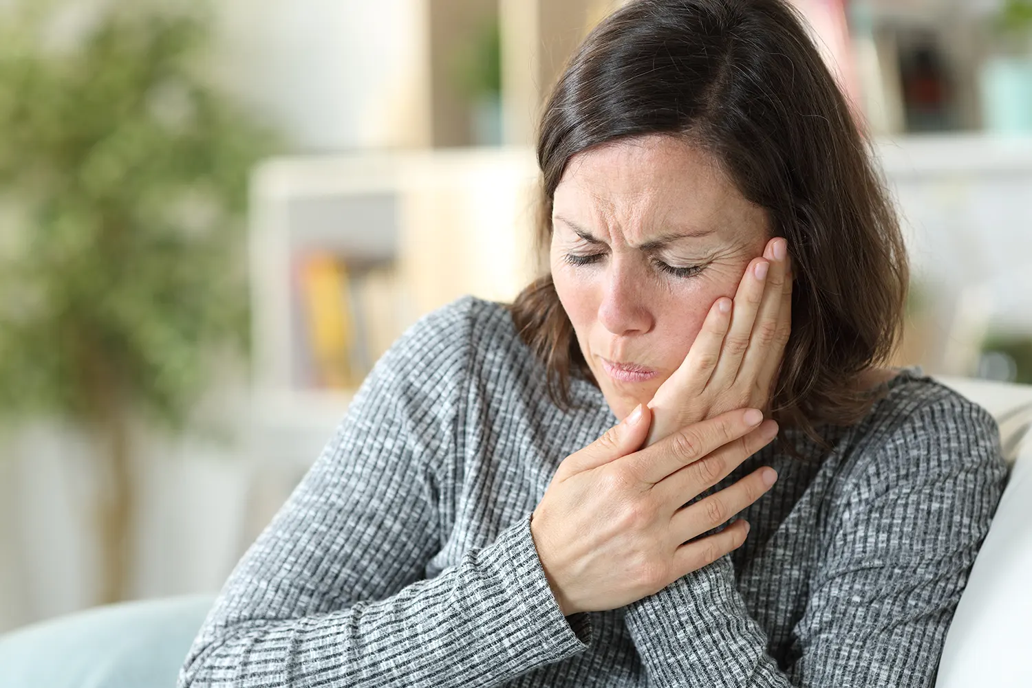 Woman experiencing chipped tooth pain