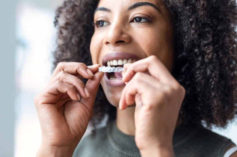 patient with clear retainer